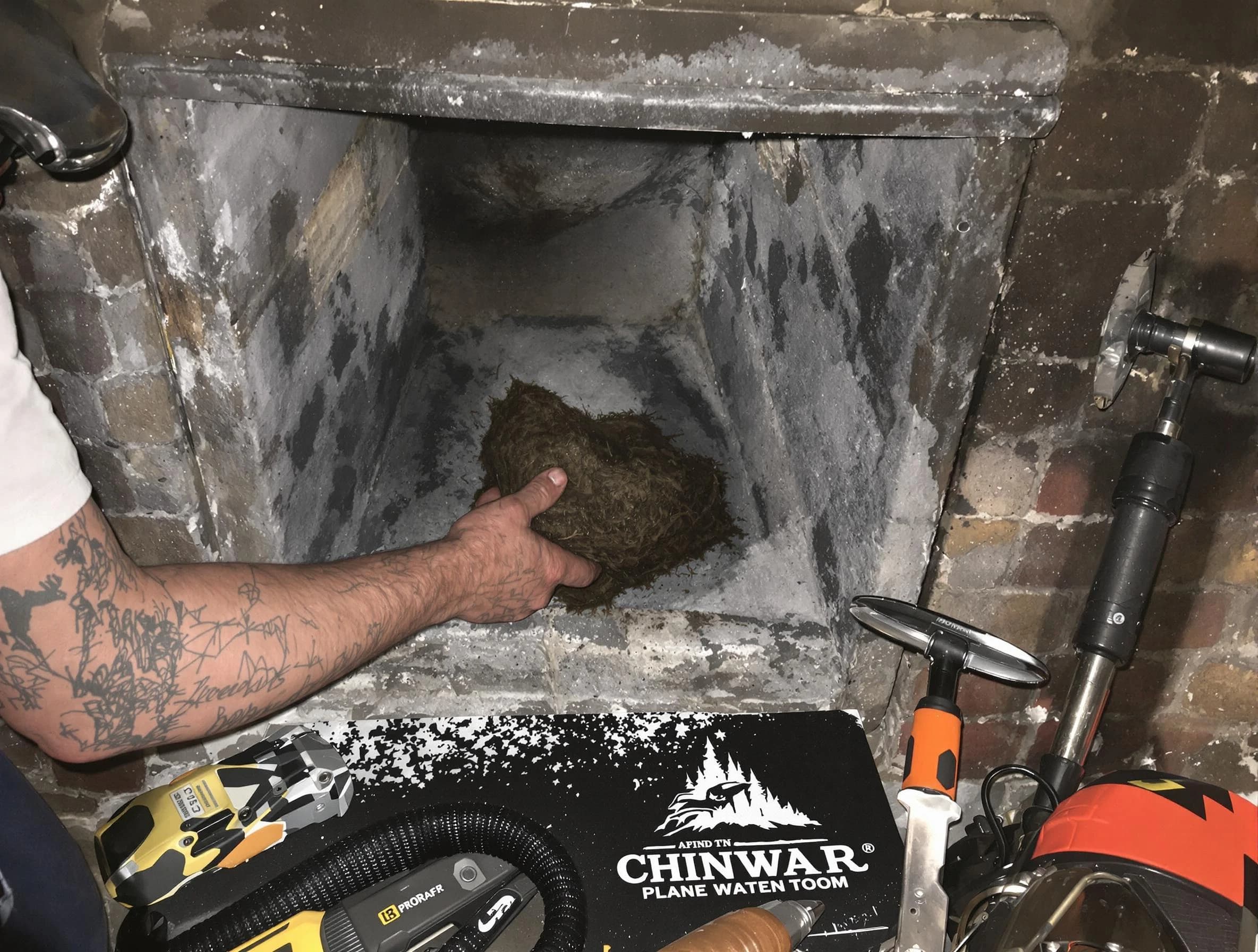 West Bountiful Chimney Sweep safely removing debris and screening chimney in West Bountiful, UT